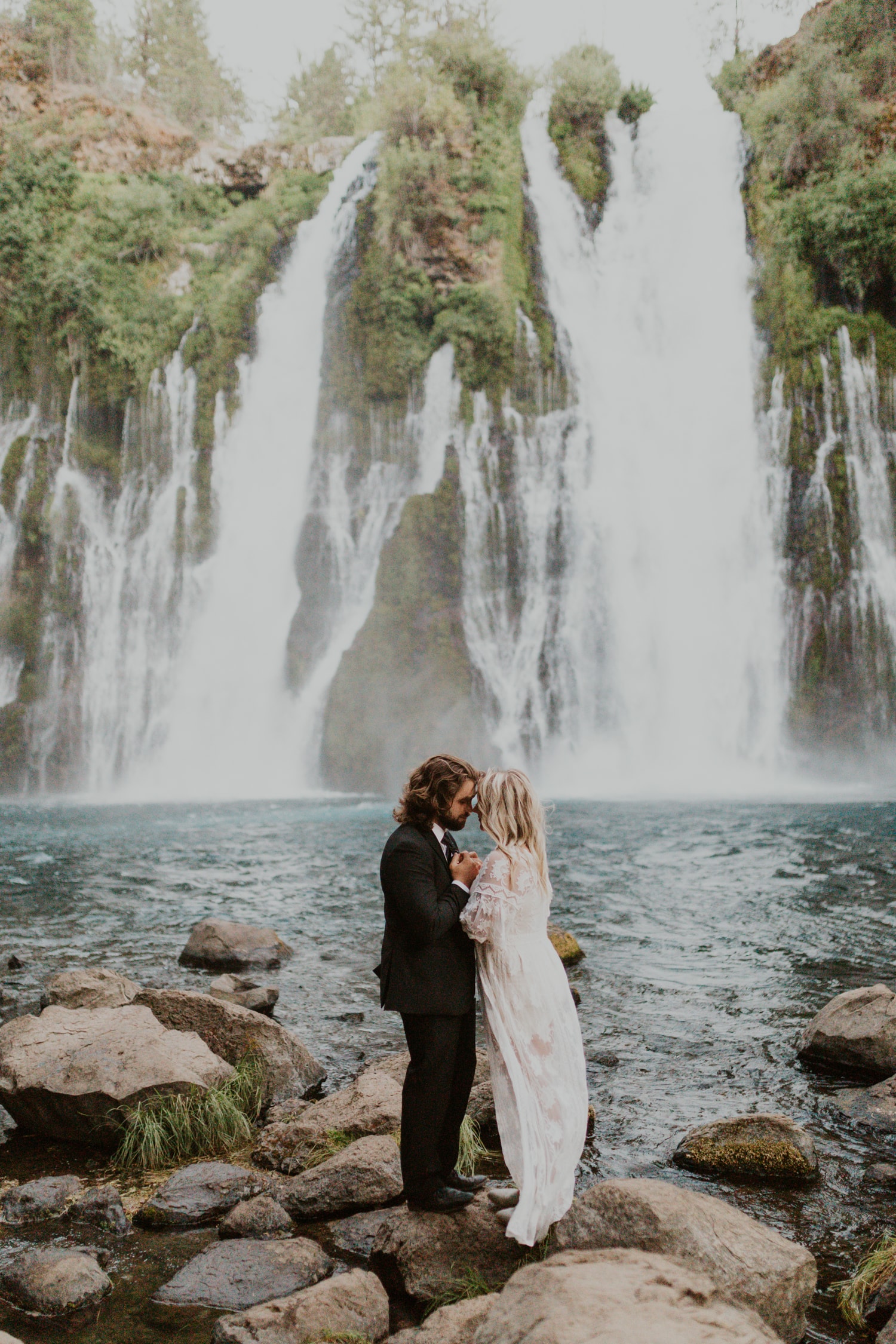 A couple eloping at a waterfall in California.