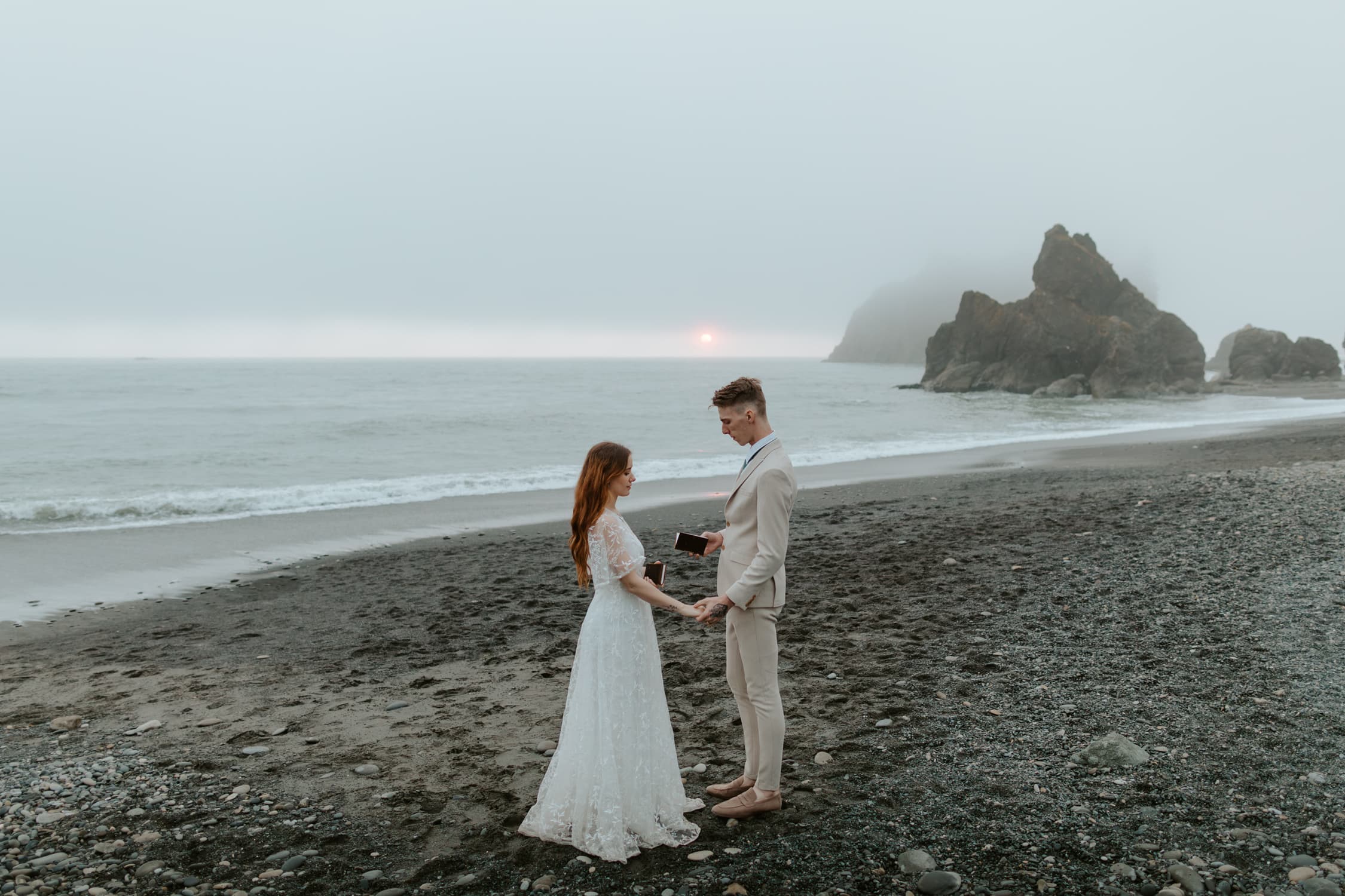 A bride and groom exchanging vows on Ruby Beach on their elopement day.